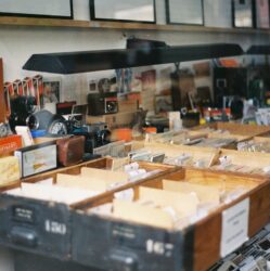 Vintage cameras and photographic equipment displayed in shop.